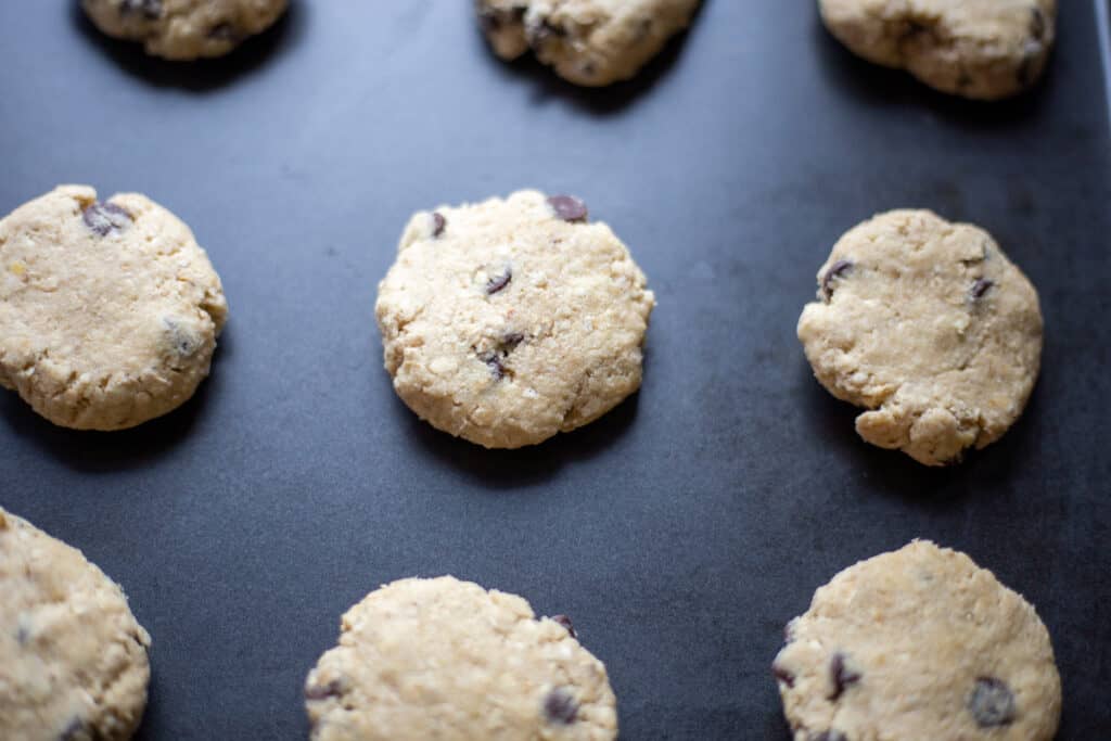 unbaked oatmeal chocolate chip cookies on baking sheet