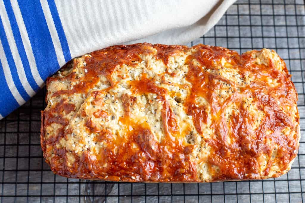 Fresh from the oven, beer bread sits o a wire cooling rack.