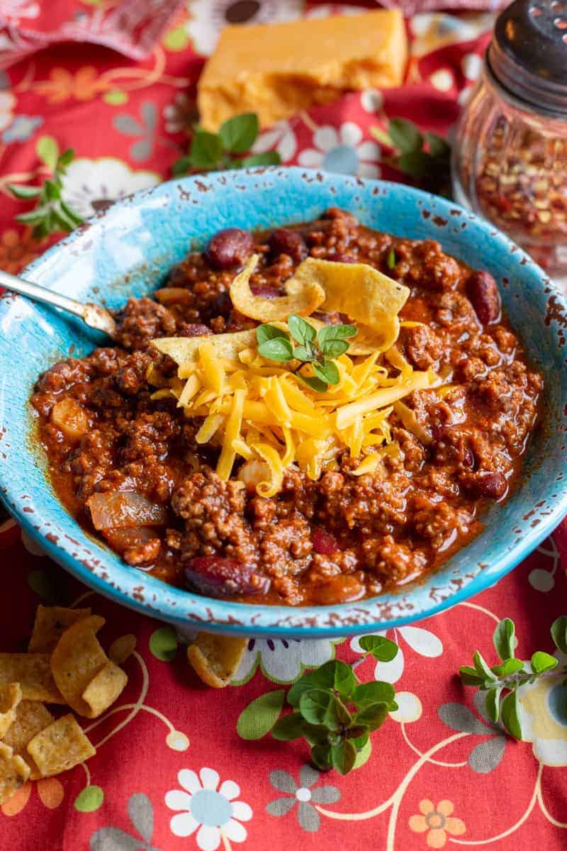 Chili served with grated cheddar cheese.