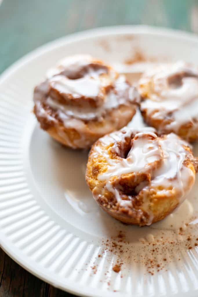 Cinnamon rolls on a white plate.