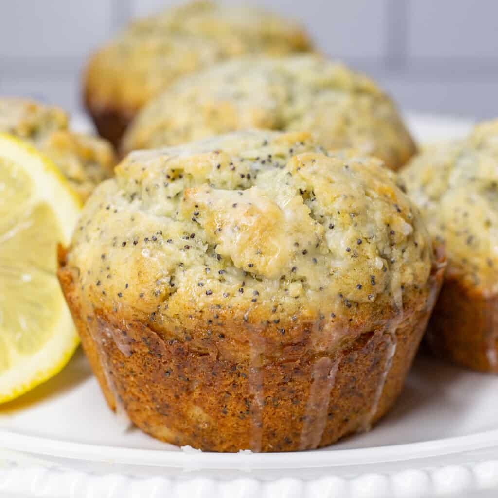 Close up image of bakery style lemon poppyseed muffins.