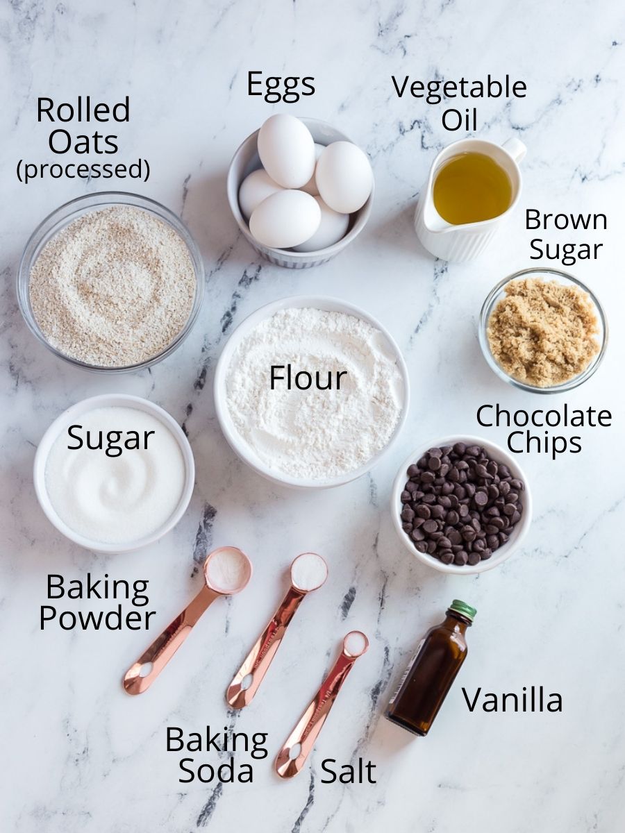 Ingredients to make chocolate chip cookies without butter on a marble board with text overlay.