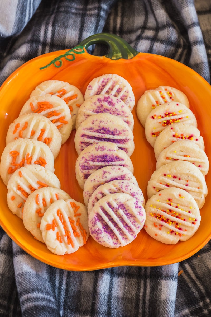 Halloween shortbread on a pumpkin shaped plate.