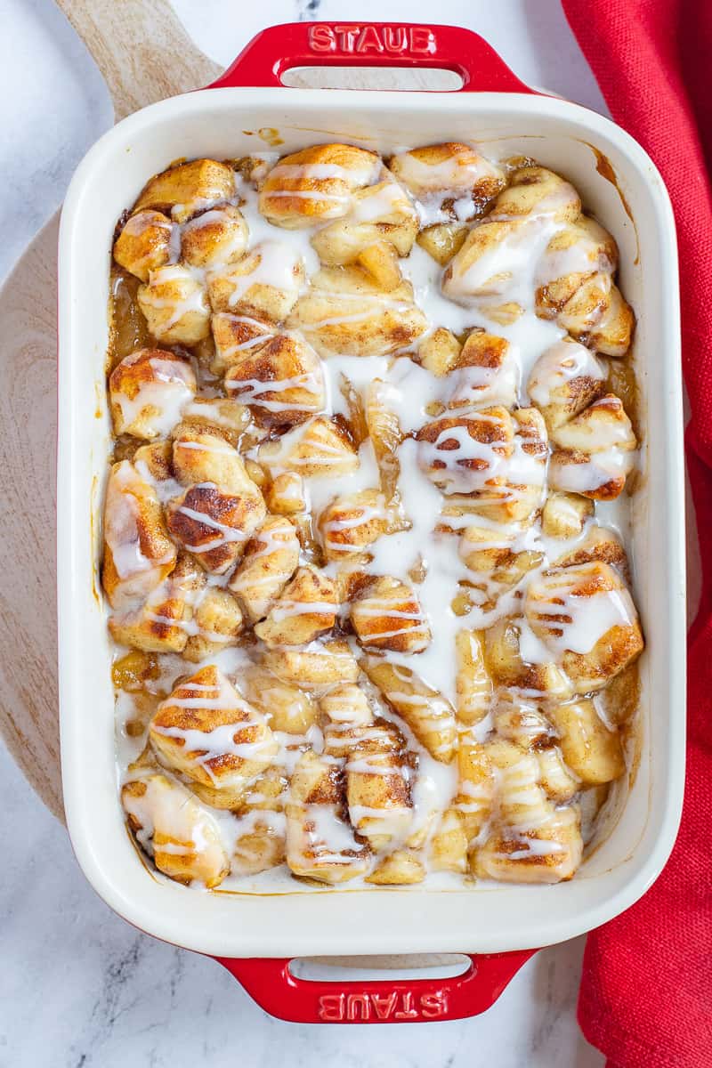 Apple cobbler cinnamon roll in baking dish.