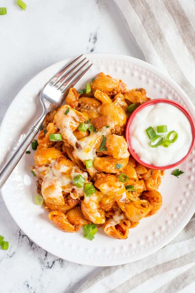 Taco pasta on a white plate.