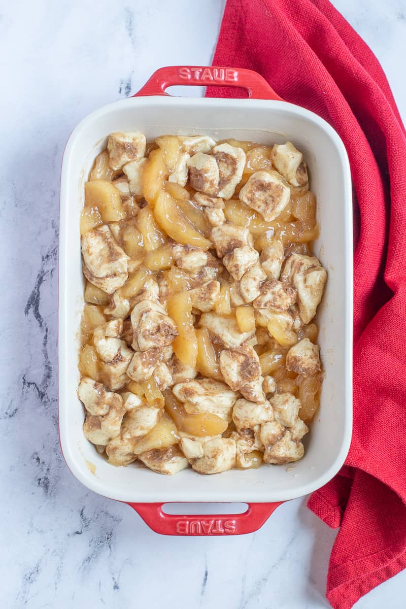 Unbaked apple cobbler in baking dish, ready to go into the oven.