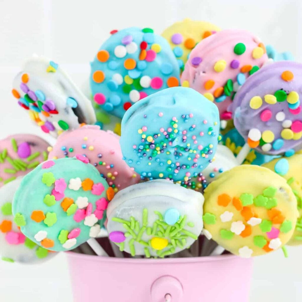 Easter chocolate covered Oreos in a pink pail.