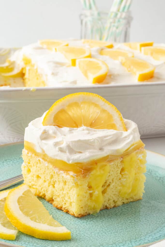 Lemon poke cake served on a plate.