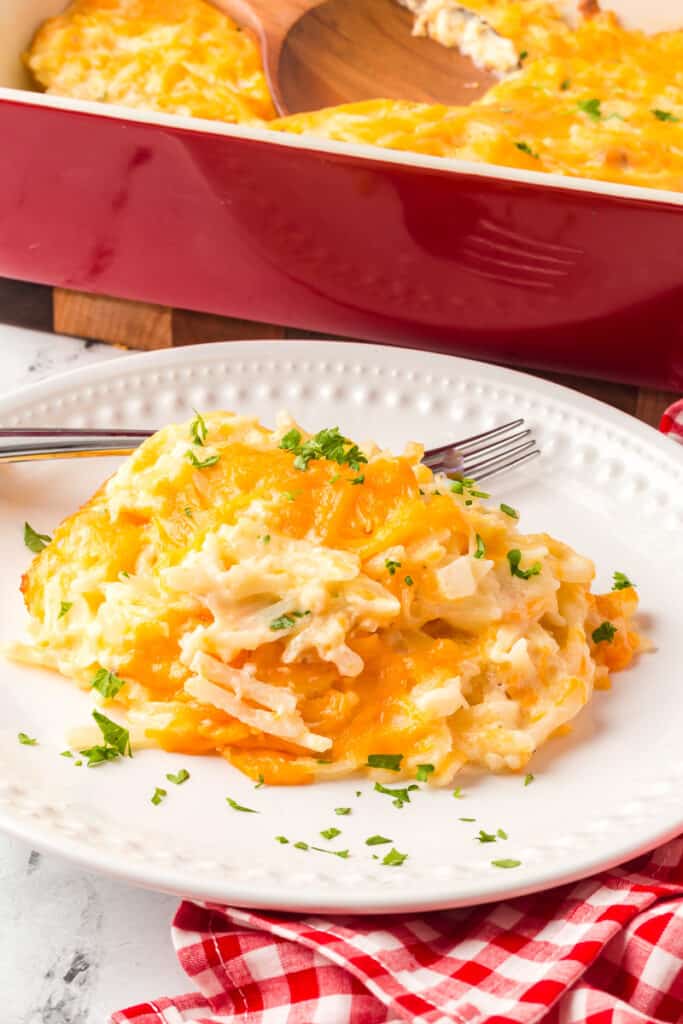 Cracker barrel hashbrown casserole on a white plate.