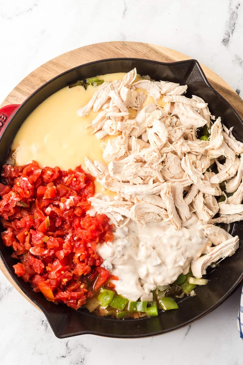 Ingredients for king ranch chicken in cast iron skillet.