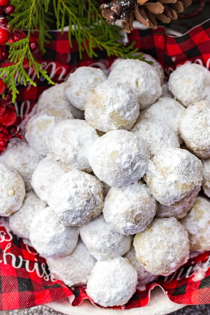 Pecan snowball cookies in a bowl.
