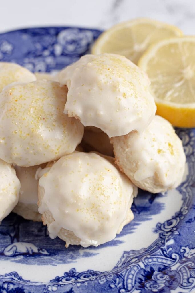Lemon ricotta cookies on a blue and white plate.