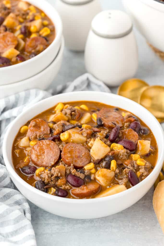 Cowboy stew in white soup bowl.