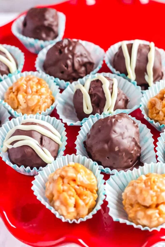 Peanut butter balls on a red plate.