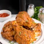Fried chicken on a white plate.