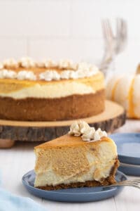 Pumpkin swirl cheesecake on a plate.