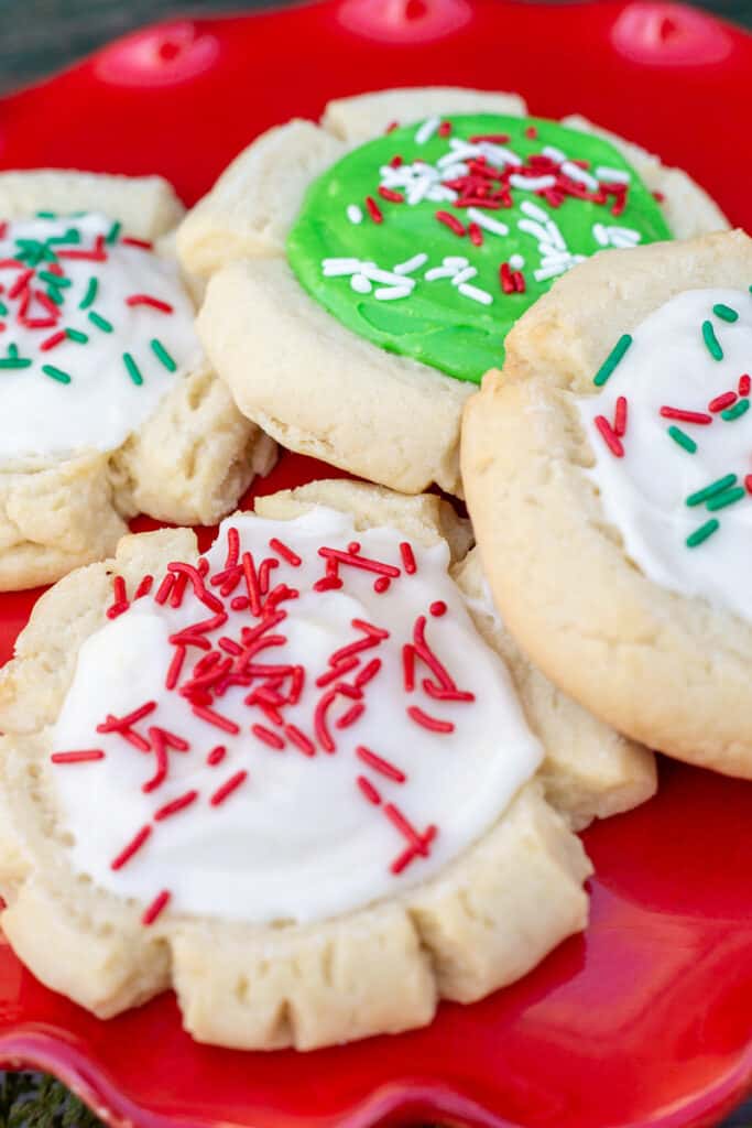 Jumbo sugar cookies on a red plate.
