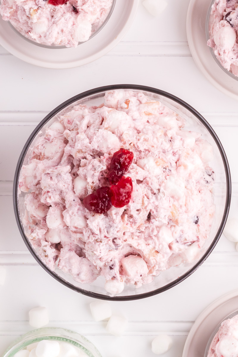 Cranberry fluff salad in a glass bowl.