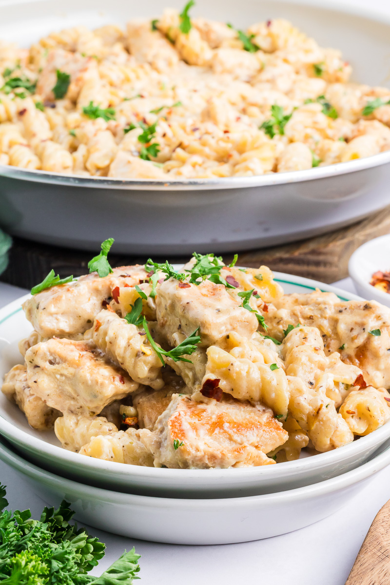 Garlic parmesan chicken pasta on a white plate.