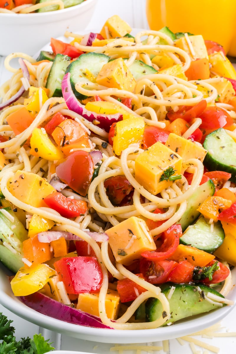 Spaghetti pasta salad in a white bowl.