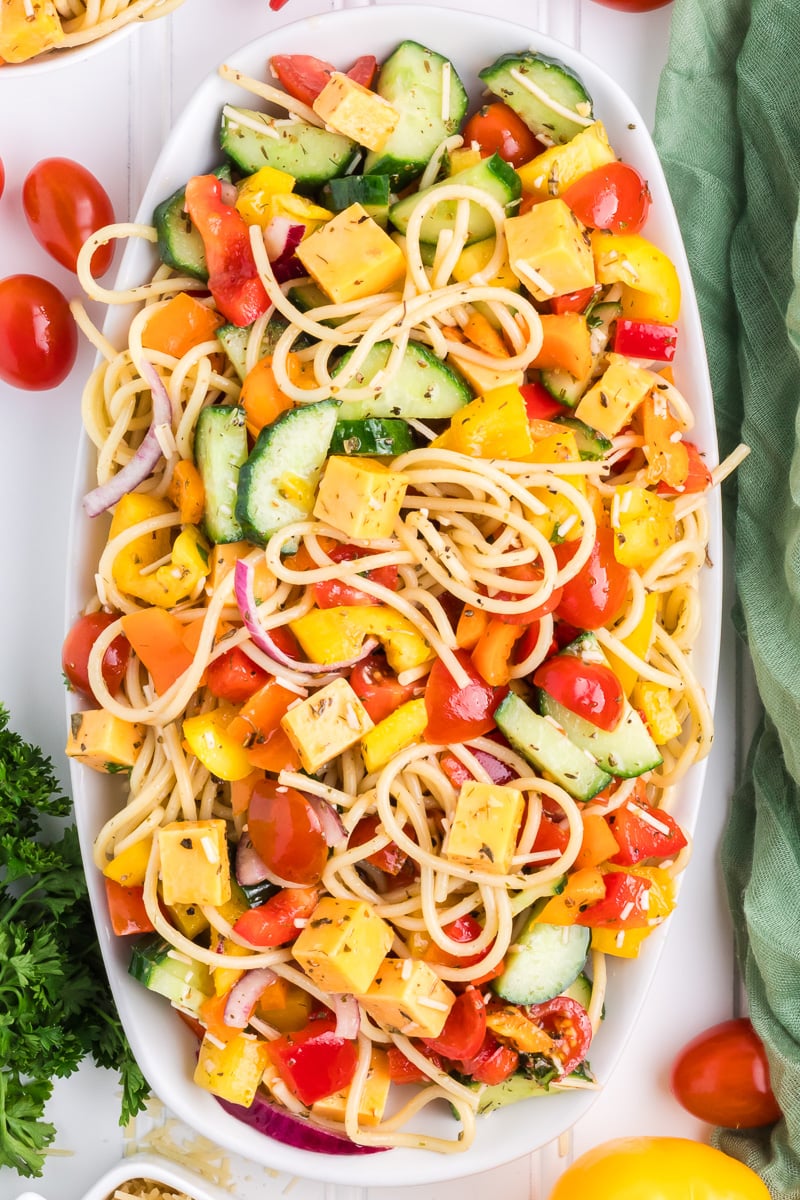 Overhead image of spaghetti psata salad on a white platter.
