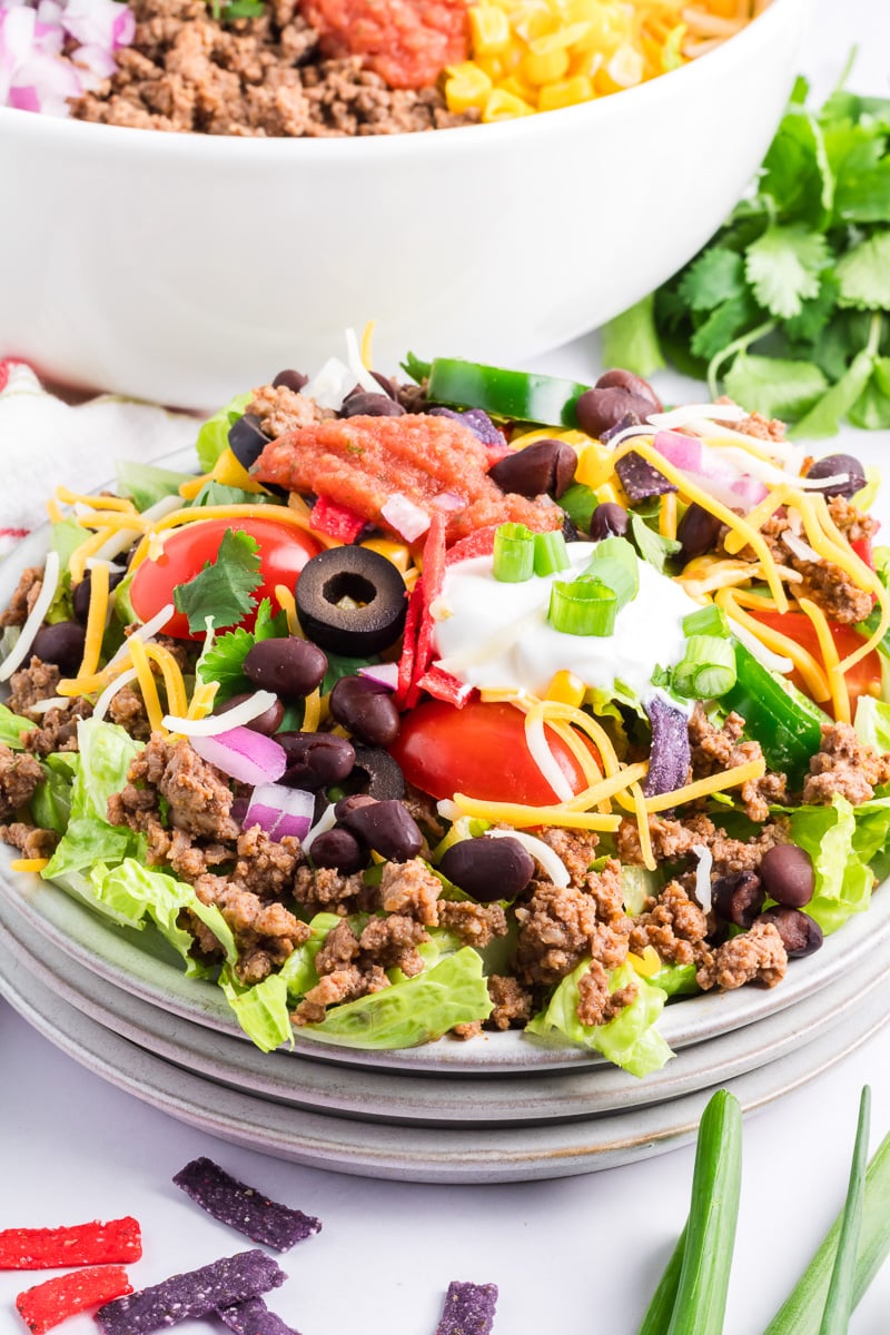 Taco salad served in a glass bowl.