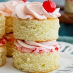 Cherry almond mini cake on a white plate.