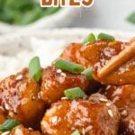 Honey garlic chicken bites on a white plate with rice.