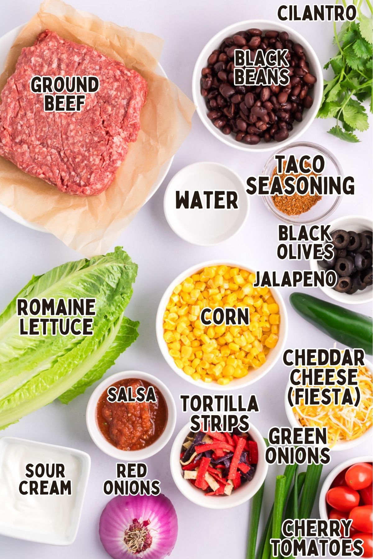 Labelled ingredients for beef taco salad.