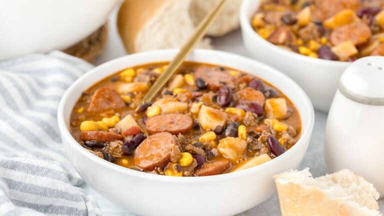 Cowboy stew in a white bowl.