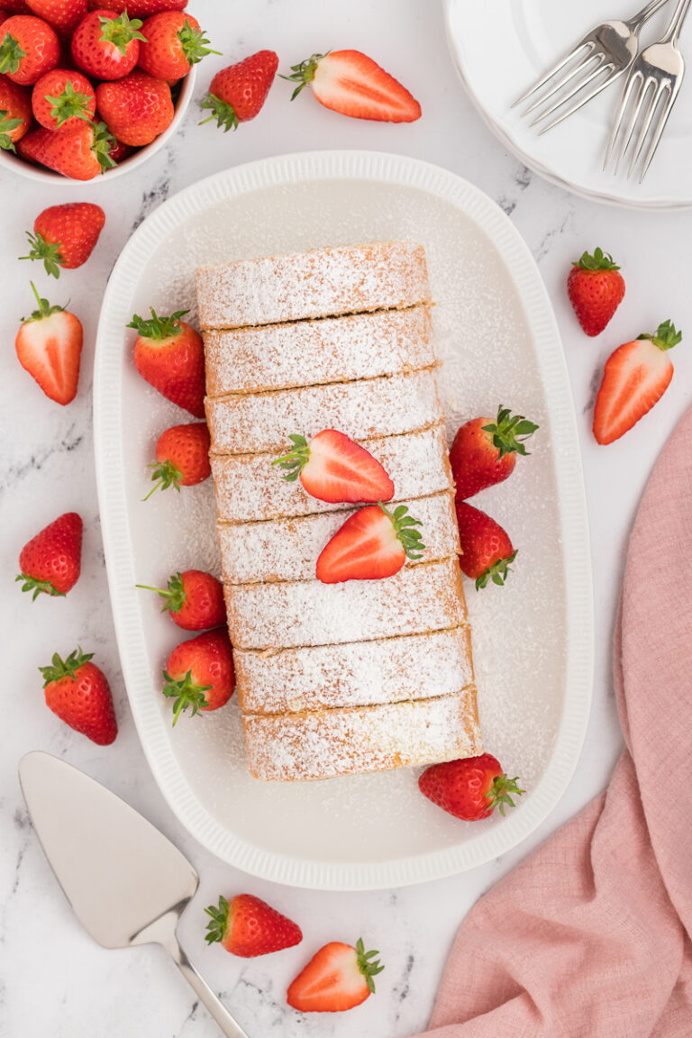 Strawberries & Cream Swiss Roll Recipe | She's Not Cookin'
