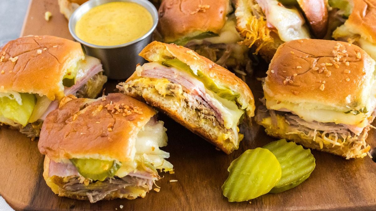 Cuban sliders on a wooden board.