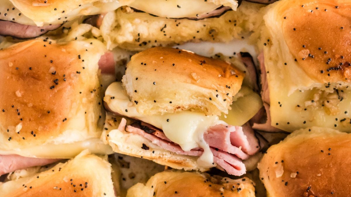 Ham & Cheese sliders on a plate.