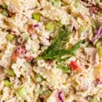 Tuna pasta salad served in a bowl with fresh dill.