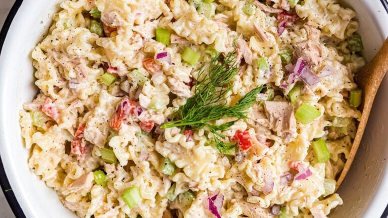 Tuna pasta salad served in a bowl with fresh dill.