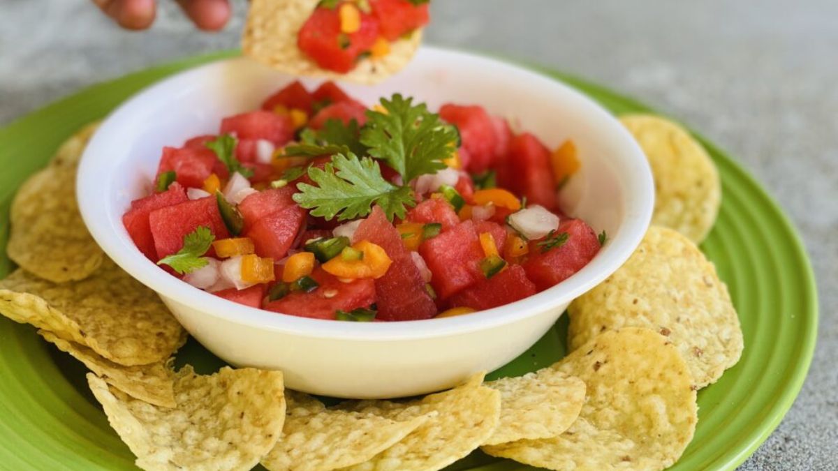 Watermelon Pico de Gallo (Salsa) in a white bowl surrounded by nacho chips.