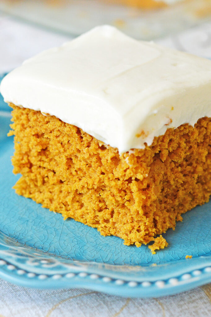 Pumpkin spice cake on a blue plate.