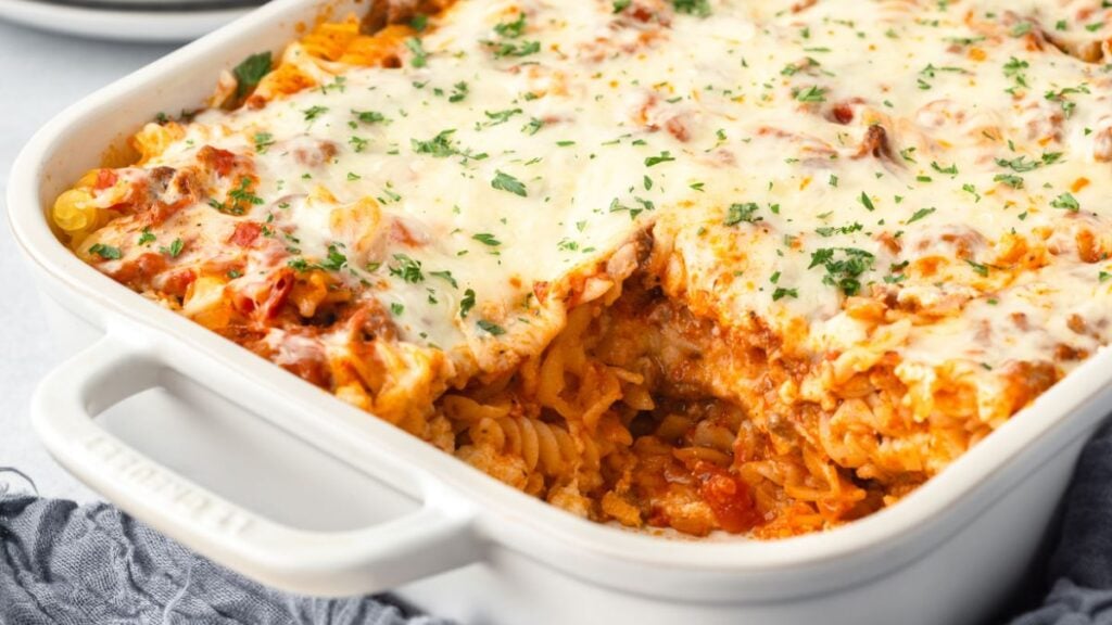 Lasagna casserole in white baking dish.