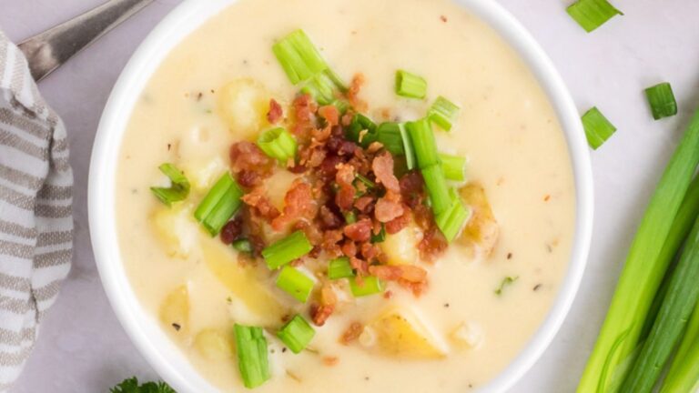 Potato soup in a white bowl.