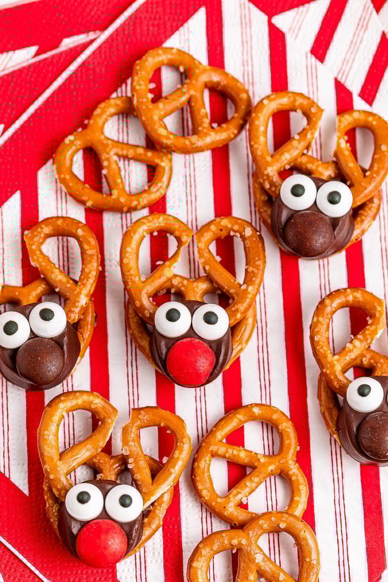 Reindeer rolo pretzels on a red and white cloth.