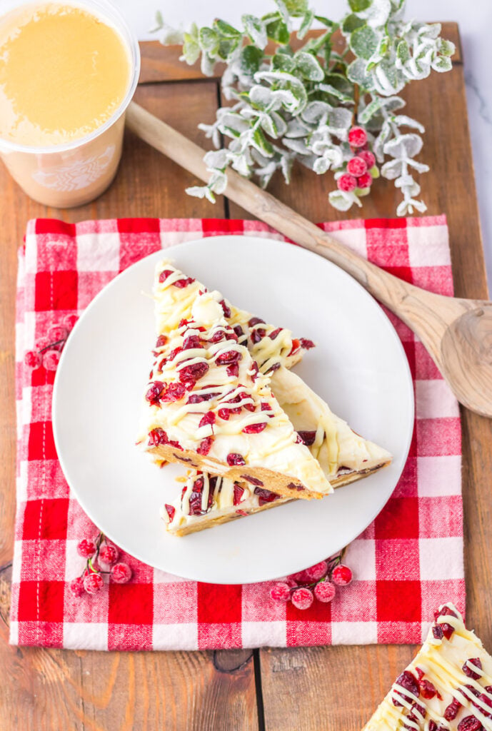 Cranberry bliss bars on a white tray.