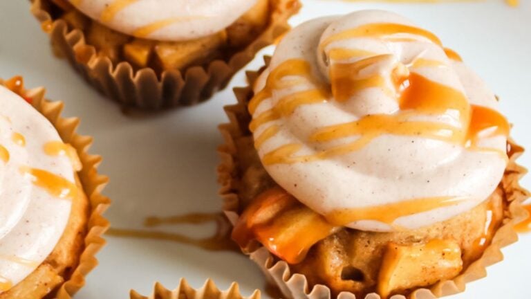 Apple cider cupcakes on a plate.