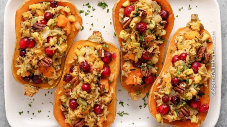 Stuffed butternut squash in white casserole dish.