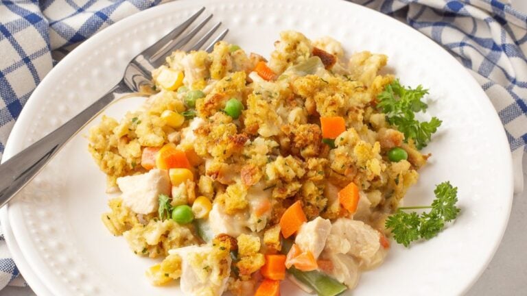 Chicken and stuffing casserole on a white plate.