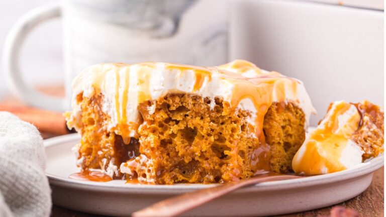 Pumpkin poke cake served on a plate.