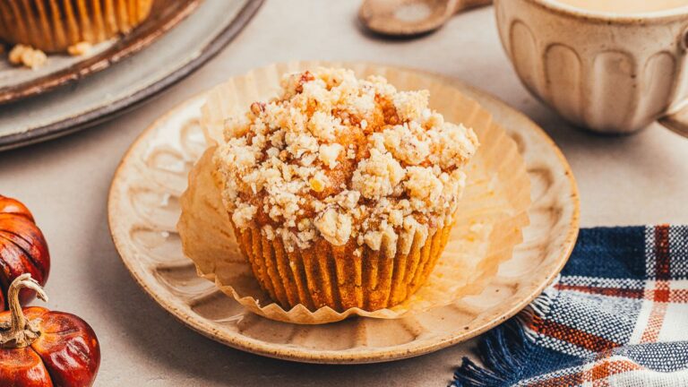 Pumpkin streusel muffins on a plate.
