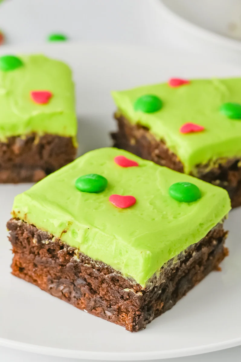 Grinch brownies cut on a plate.