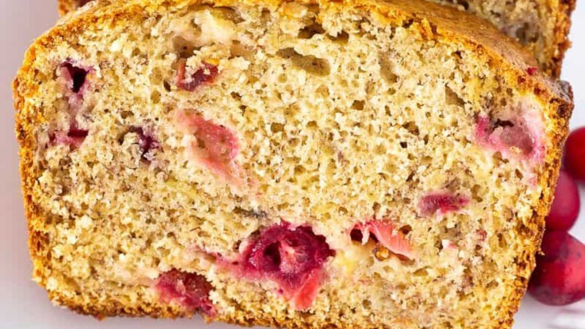 Cranberry banana bread on a white plate.