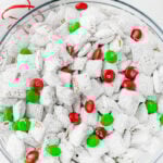 Bowl of muddy buddy mix with M&M candy.
