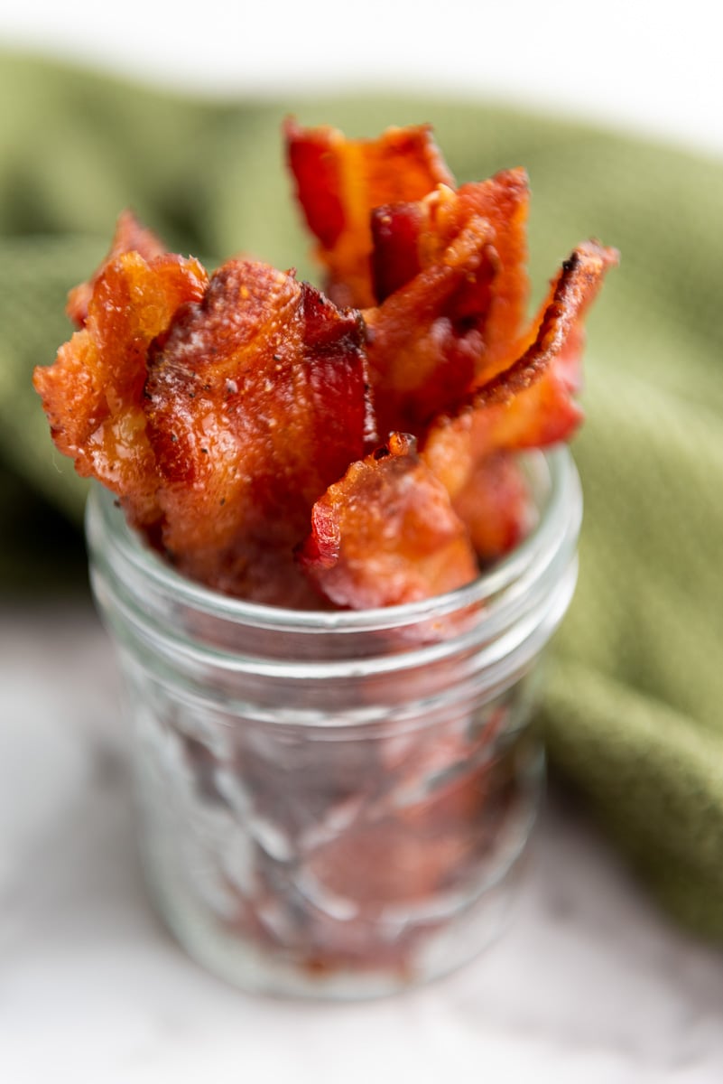 Candied bacon in glass jar.